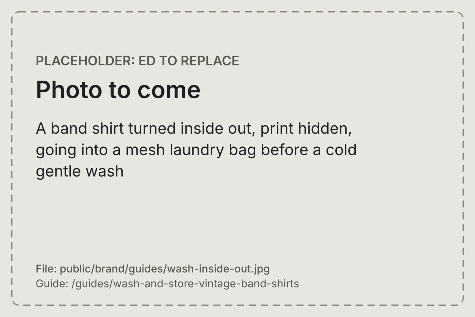 A band shirt turned inside out, print hidden, going into a mesh laundry bag before a cold gentle wash